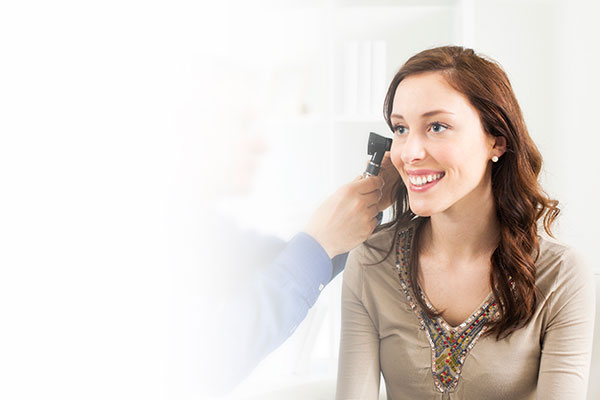 Woman beginning a hearing test interview
