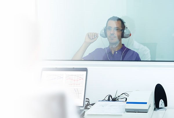 Woman beginning a hearing test interview